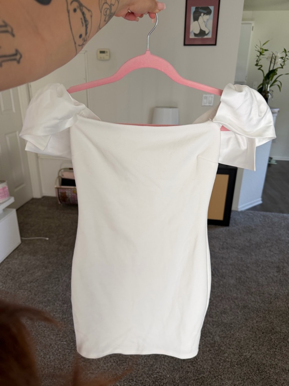 White mini dress with bow sleeves